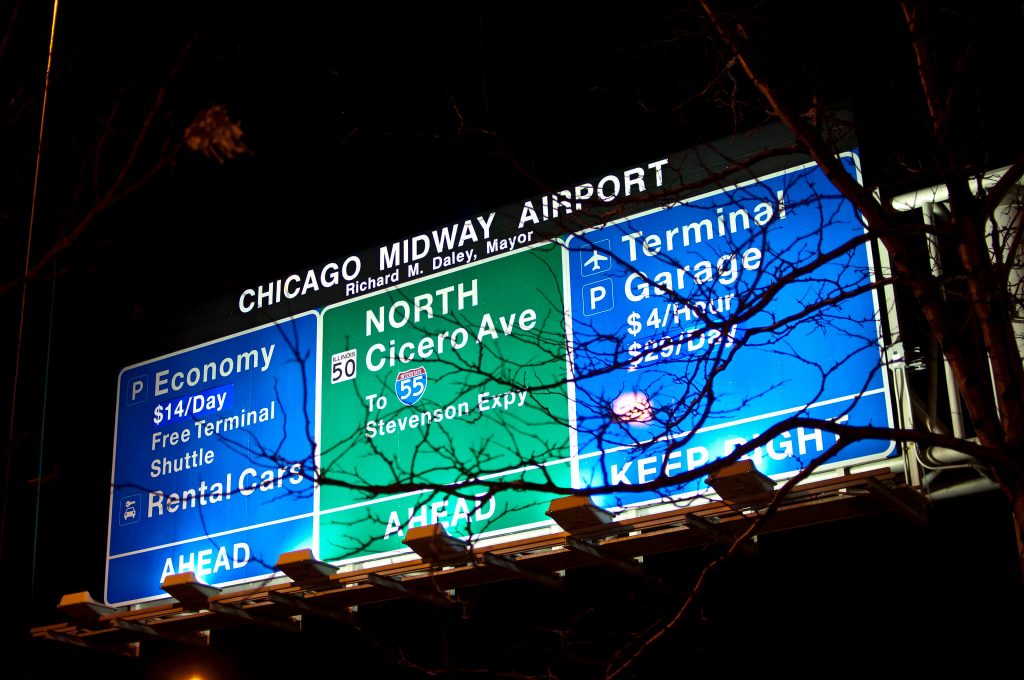 How far are O'Hare and Midway airports from Downtown Chicago?